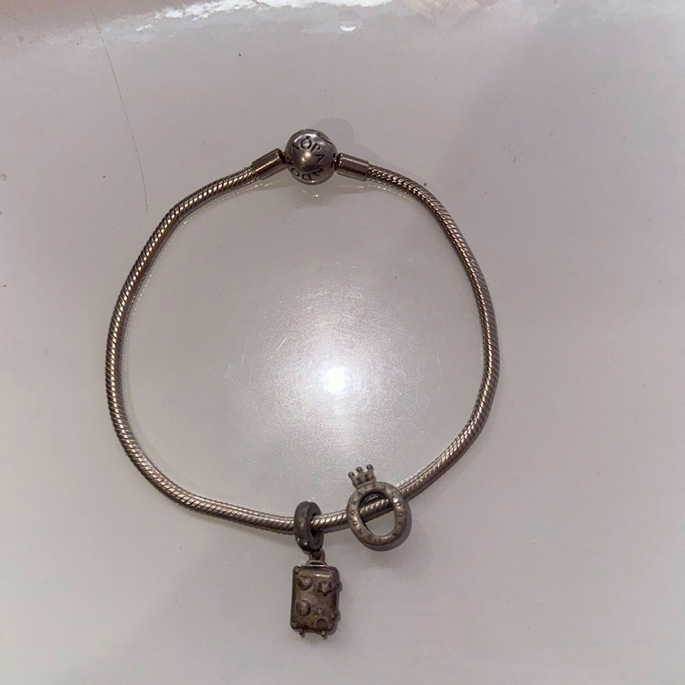 Authentic 7.5 inch Pandora bracelet with charms included